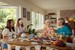 4 women sitting at a table having morning tea